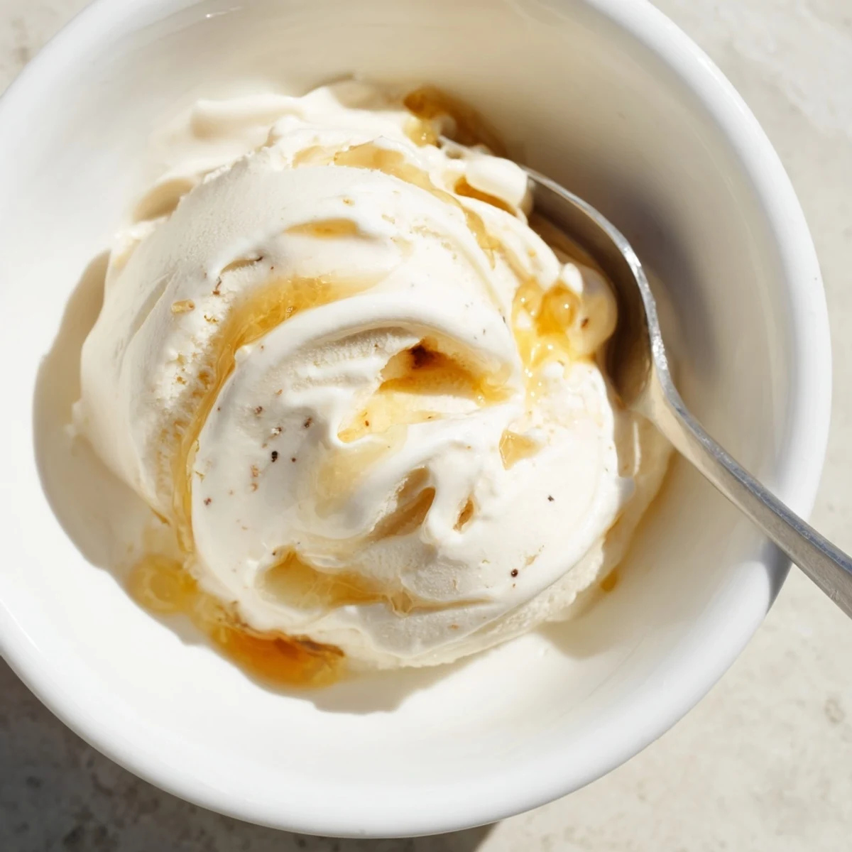 Creamy cottage cheese ice cream swirled with fresh berries, a cool and refreshing dessert.