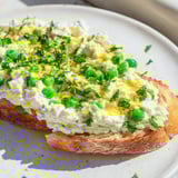 Vibrant Pea & Mint Ricotta Toast with creamy whipped ricotta and fresh mint on golden sourdough slices.