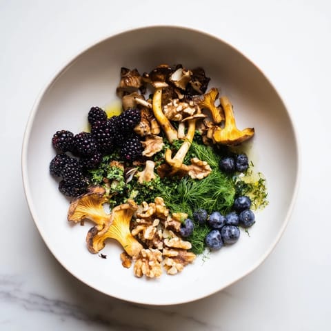 Enjoying a plate of Northwest Forest Forager salad with vibrant berries, nuts, and fresh herbs.